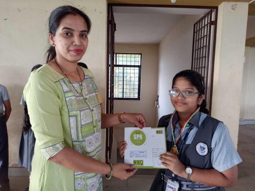 Aparna Shetti received a medal and a certificate of merit for the Olympiad Examination 2022-2023